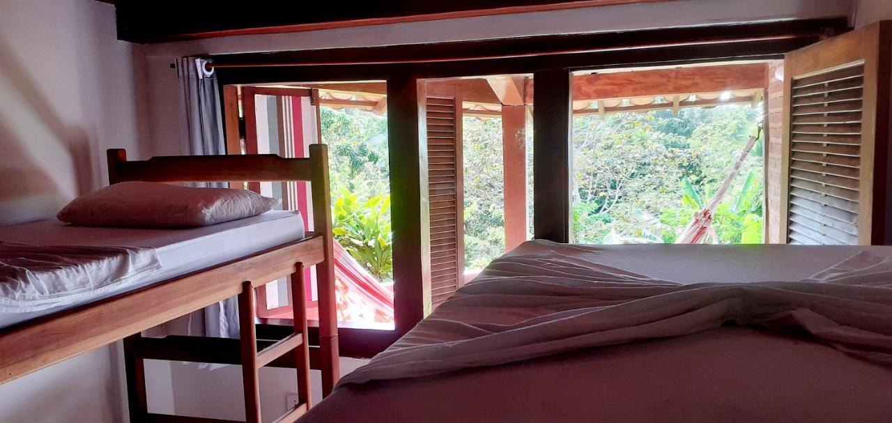 Novos Baianos Hostel E Pousada ปอร์โตเซกูโร ภายนอก รูปภาพ A room at the hostel