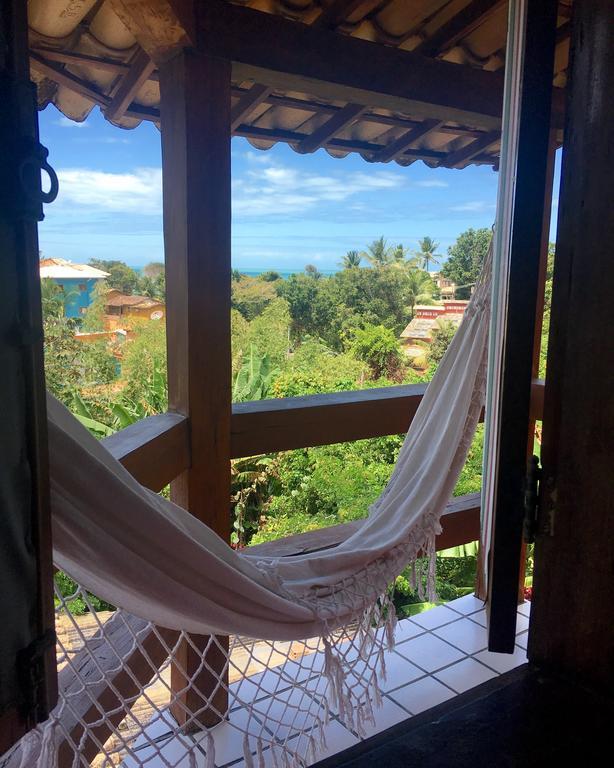 Novos Baianos Hostel E Pousada ปอร์โตเซกูโร ภายนอก รูปภาพ Hammock in a hotel in San Juan del Sur, Nicaragua