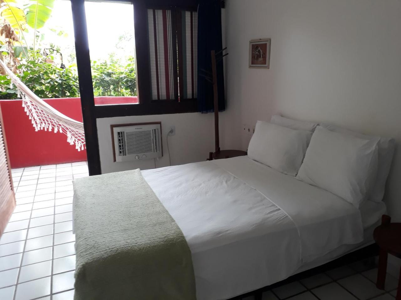 Novos Baianos Hostel E Pousada ปอร์โตเซกูโร ภายนอก รูปภาพ A room at the hotel